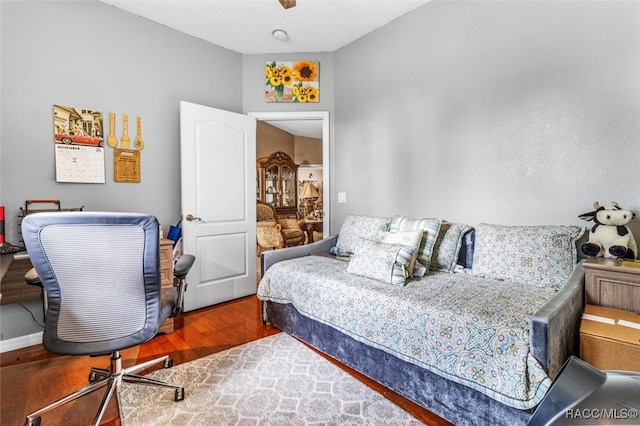 bedroom with hardwood / wood-style floors