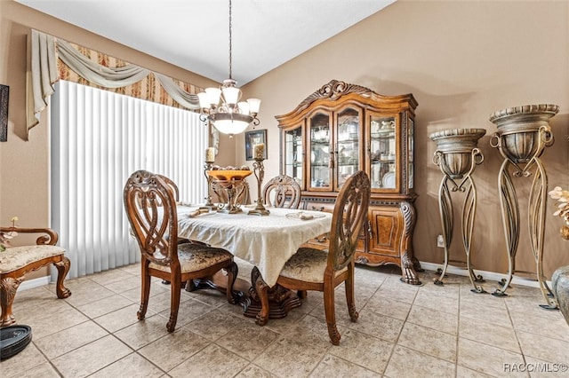 dining room featuring tile patterned floors and a chandelier