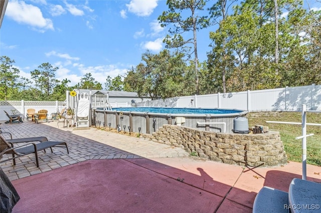 view of patio featuring a fenced in pool