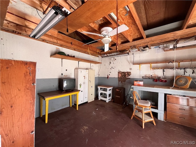 basement featuring a workshop area and ceiling fan