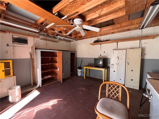 basement featuring a workshop area and ceiling fan