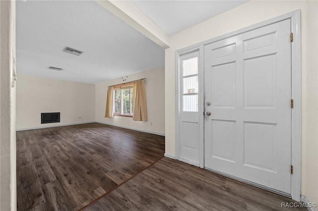 entryway featuring wood finished floors, visible vents, and baseboards