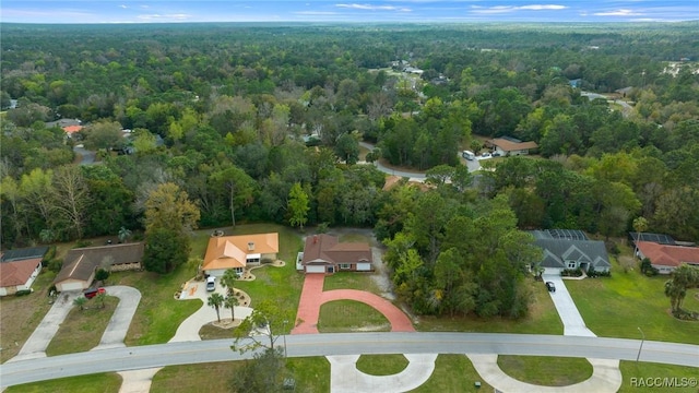 drone / aerial view featuring a forest view