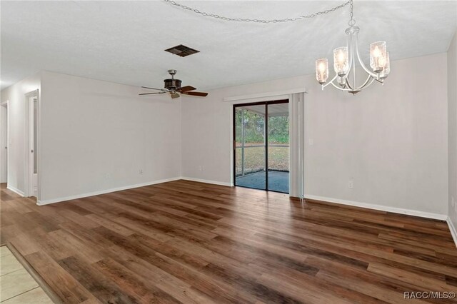 living room with a textured ceiling, ceiling fan with notable chandelier, and light hardwood / wood-style flooring