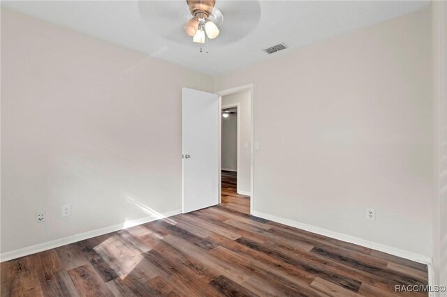 bedroom featuring dark hardwood / wood-style flooring and ceiling fan