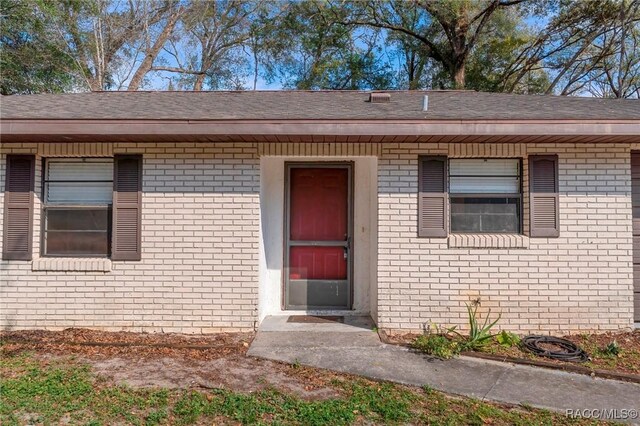 ranch-style home with a front lawn and a garage