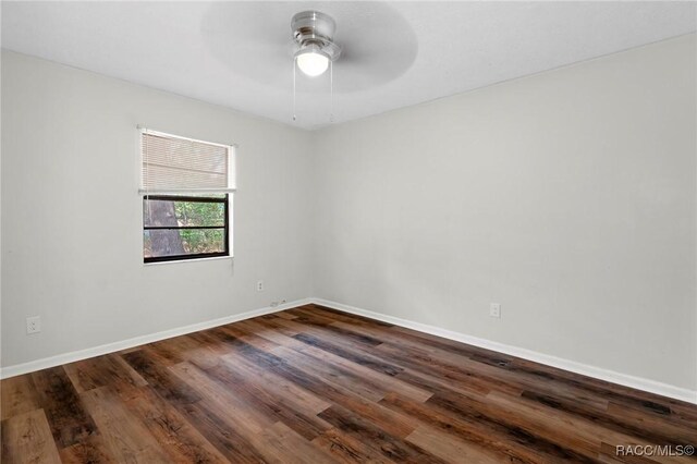 bedroom with a textured ceiling, dark wood-type flooring, and a closet