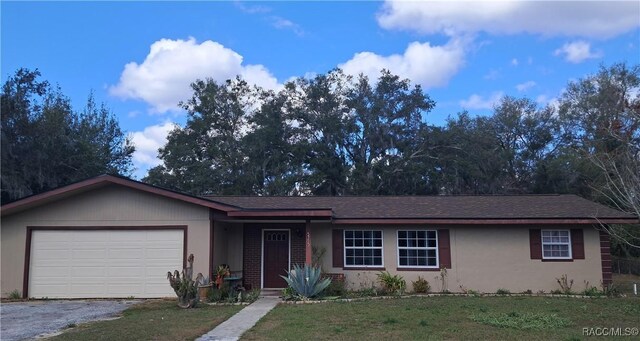 single story home featuring a garage