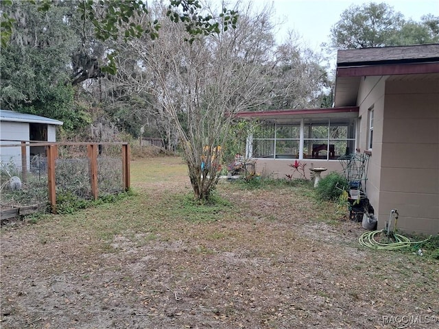 view of yard with a sunroom