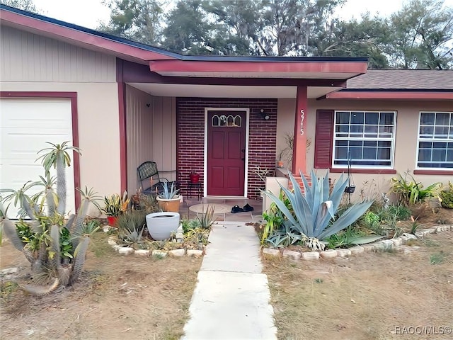 entrance to property featuring a garage