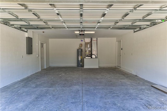 garage featuring electric panel, electric water heater, and a garage door opener