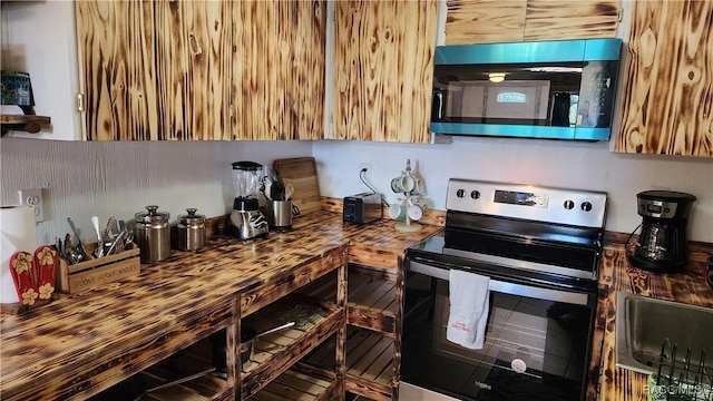 kitchen with sink and appliances with stainless steel finishes