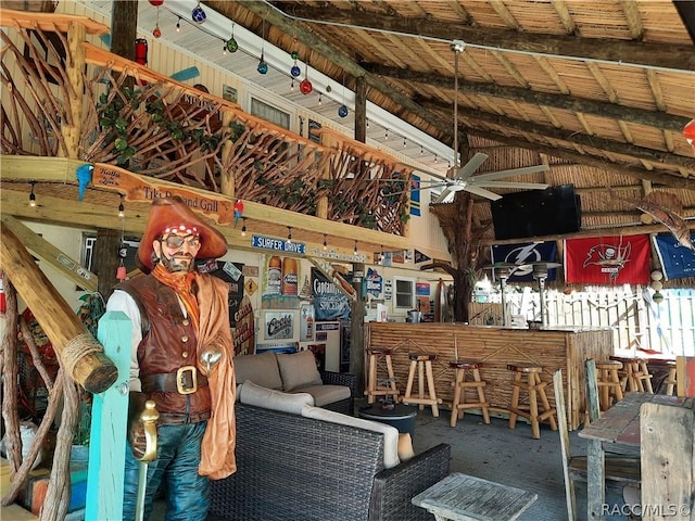 miscellaneous room with ceiling fan and lofted ceiling