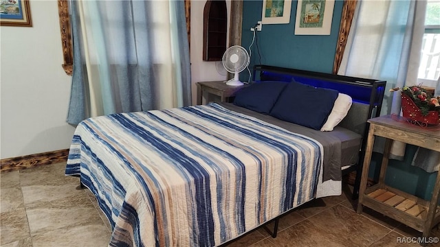 bedroom with tile patterned floors