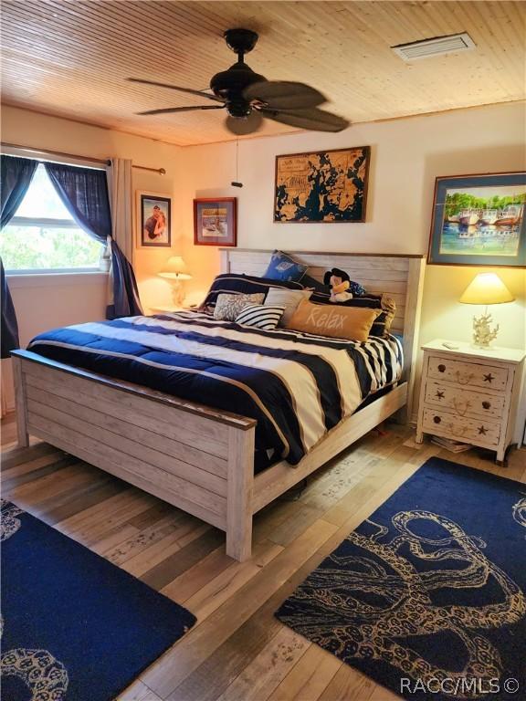 bedroom featuring hardwood / wood-style floors and ceiling fan