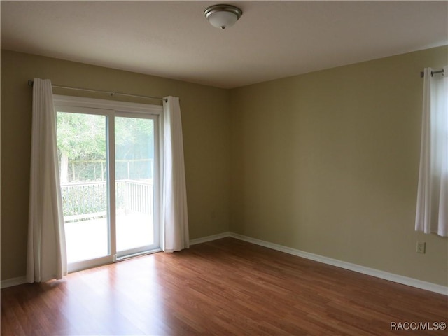 unfurnished room featuring hardwood / wood-style floors