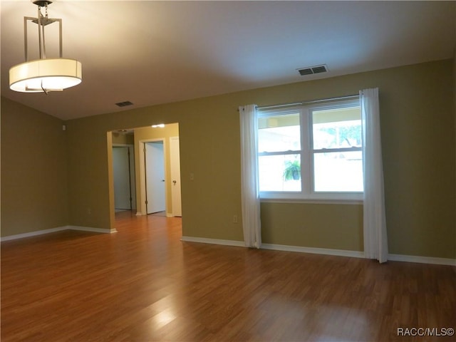 empty room featuring hardwood / wood-style floors