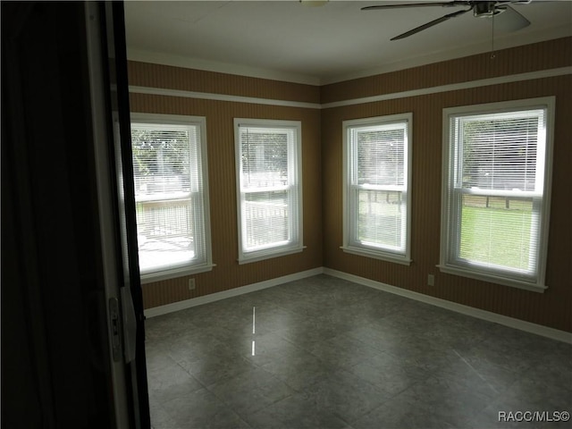 interior space featuring ceiling fan