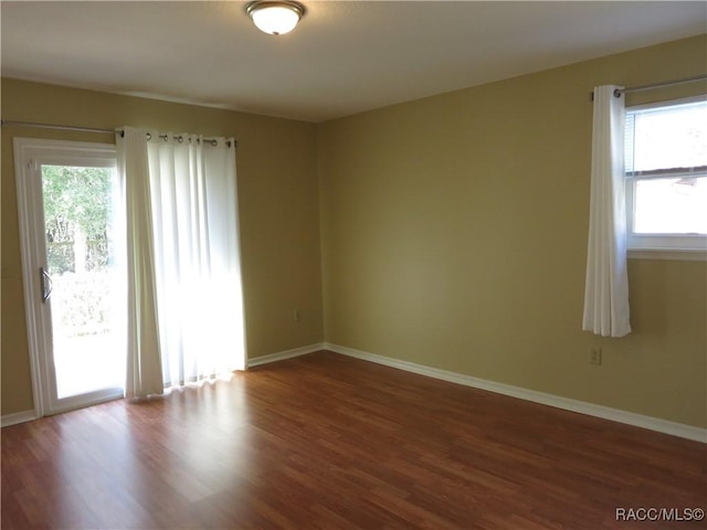 empty room featuring hardwood / wood-style flooring