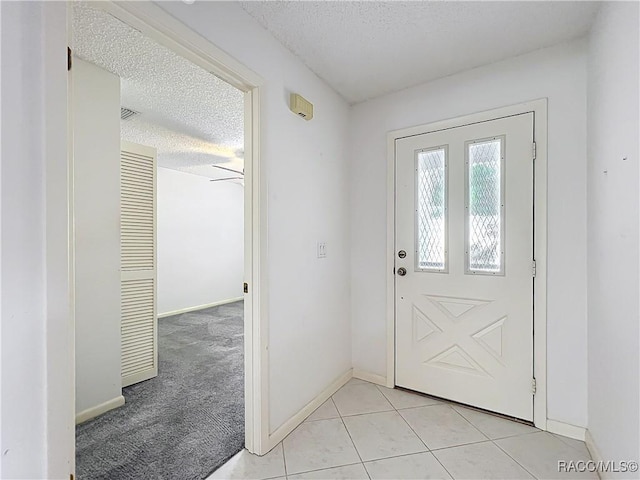 3328 S Whitechappel Pt, Inverness, FL 34452 - entryway with a textured ceiling and light tile patterned floors
