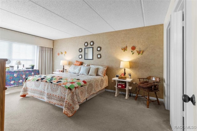 carpeted bedroom with a textured ceiling