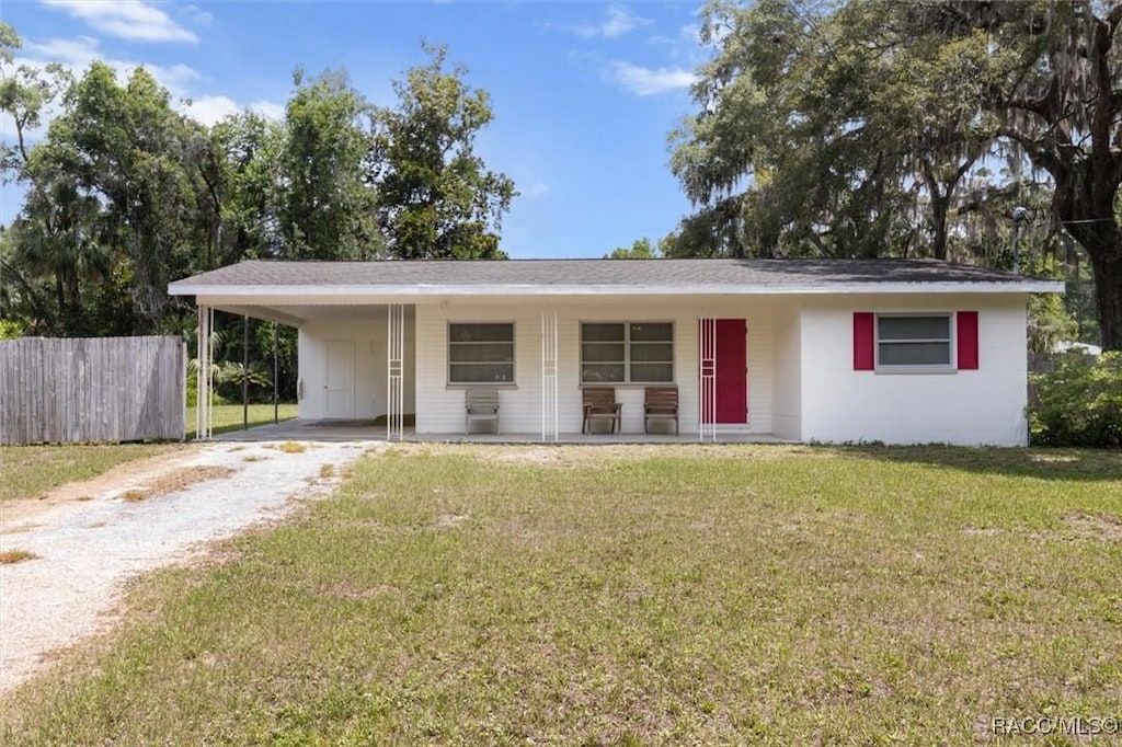 9665 W Orchard St, Crystal River, FL 34428 - ranch-style house with driveway, a porch, and a carport
