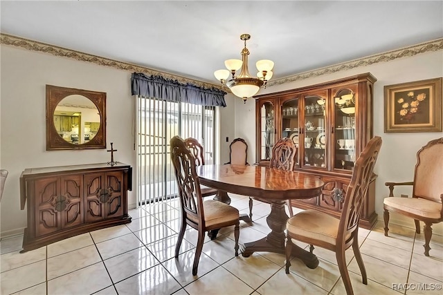 tiled dining space featuring a chandelier