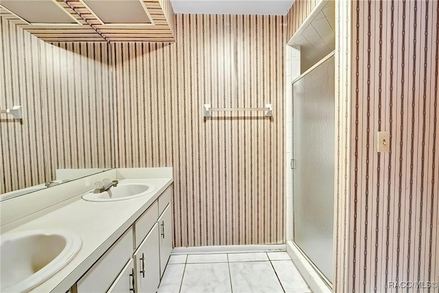 bathroom with vanity, tile patterned floors, and walk in shower