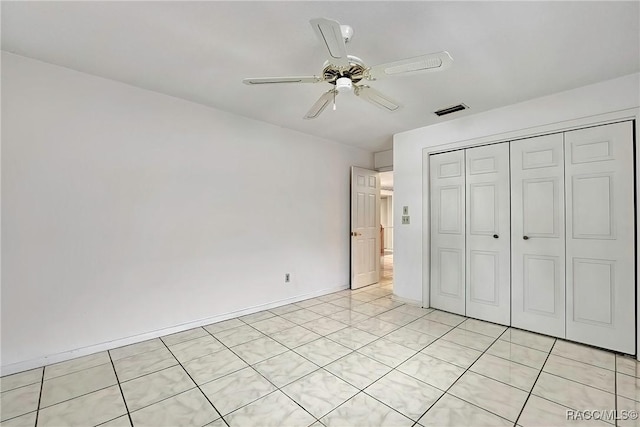 unfurnished bedroom featuring a closet and ceiling fan