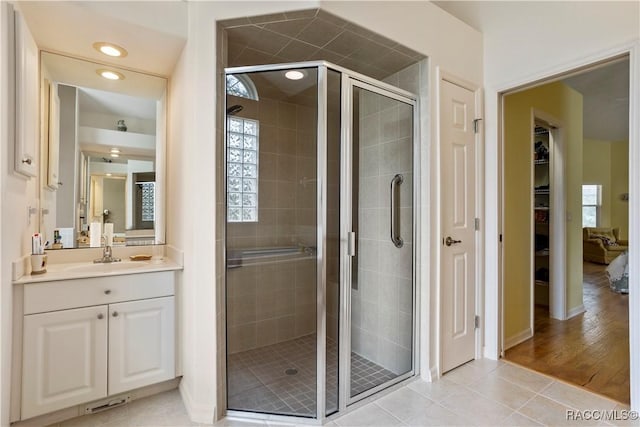 5799 N Oakmont Dr, Beverly Hills, FL 34465 - bathroom with vanity, a shower stall, tile patterned flooring, a walk in closet, and recessed lighting