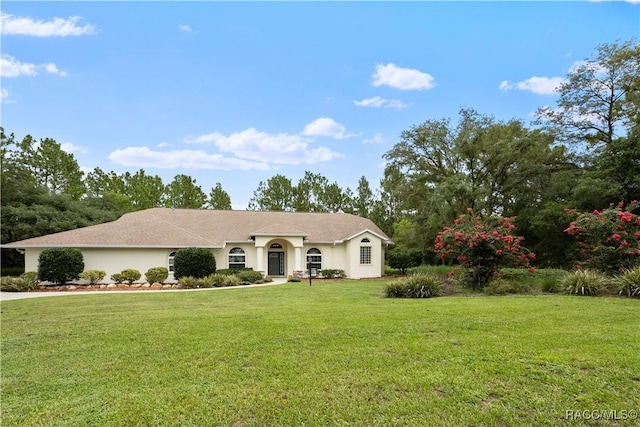 5799 N Oakmont Dr, Beverly Hills, FL 34465 - single story home featuring a front yard and stucco siding