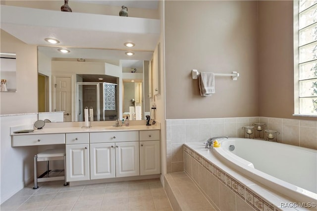 5799 N Oakmont Dr, Beverly Hills, FL 34465 - full bathroom with vanity, a stall shower, a bath, and tile patterned floors