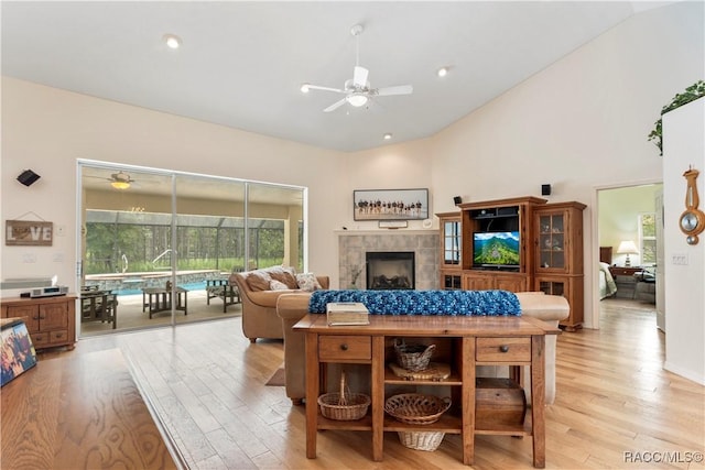 5799 N Oakmont Dr, Beverly Hills, FL 34465 - living area with ceiling fan, light wood finished floors, a fireplace, and high vaulted ceiling