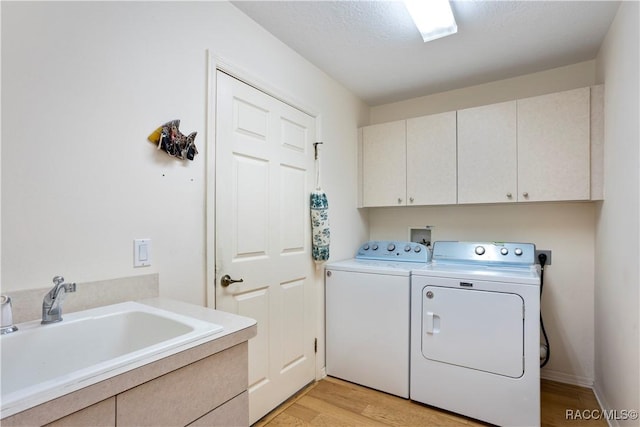 5799 N Oakmont Dr, Beverly Hills, FL 34465 - laundry room with cabinet space, independent washer and dryer, and light wood-style floors