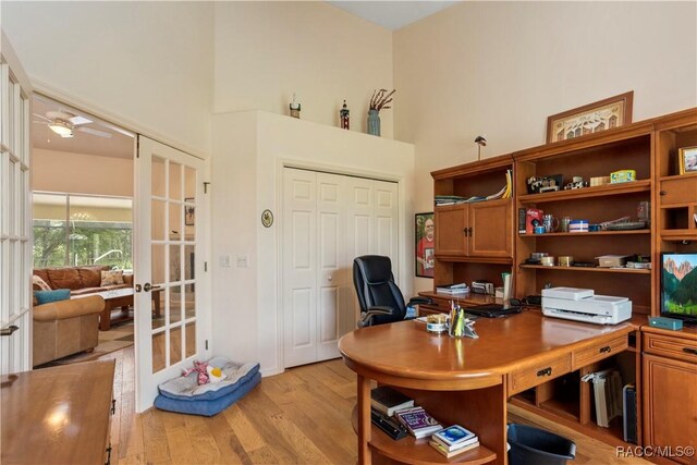 5799 N Oakmont Dr, Beverly Hills, FL 34465 - office area with a towering ceiling, light wood-style flooring, and french doors