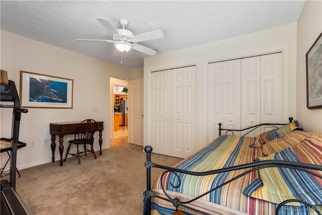 5799 N Oakmont Dr, Beverly Hills, FL 34465 - bedroom featuring multiple closets, carpet floors, and a ceiling fan