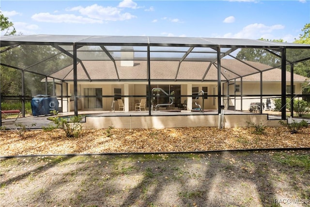 5799 N Oakmont Dr, Beverly Hills, FL 34465 - rear view of property featuring a lanai and a patio area