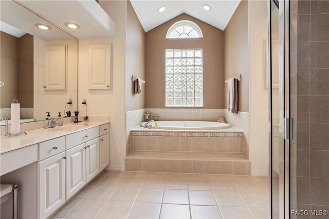 5799 N Oakmont Dr, Beverly Hills, FL 34465 - full bath with vanity, a bath, lofted ceiling, and tile patterned flooring