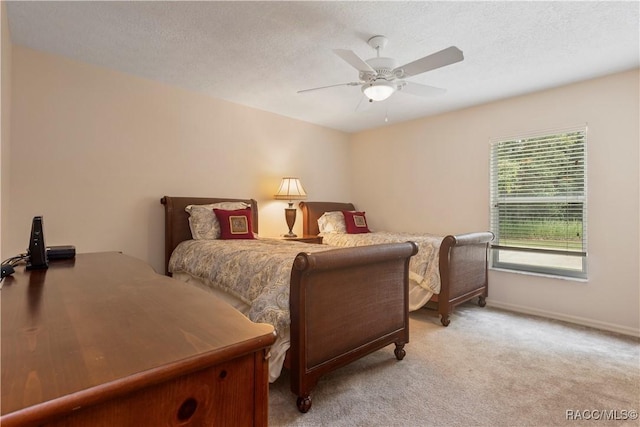 5799 N Oakmont Dr, Beverly Hills, FL 34465 - bedroom featuring light carpet, a ceiling fan, and a textured ceiling