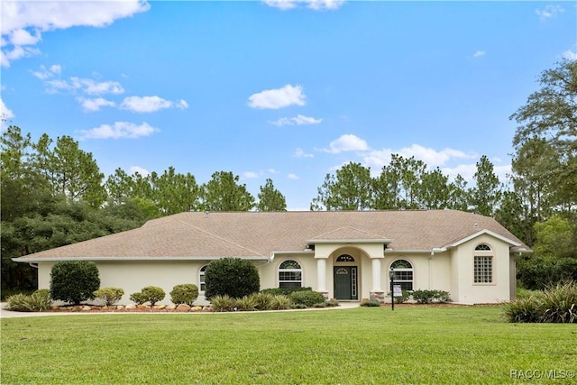 5799 N Oakmont Dr, Beverly Hills, FL 34465 - ranch-style home featuring stucco siding and a front yard