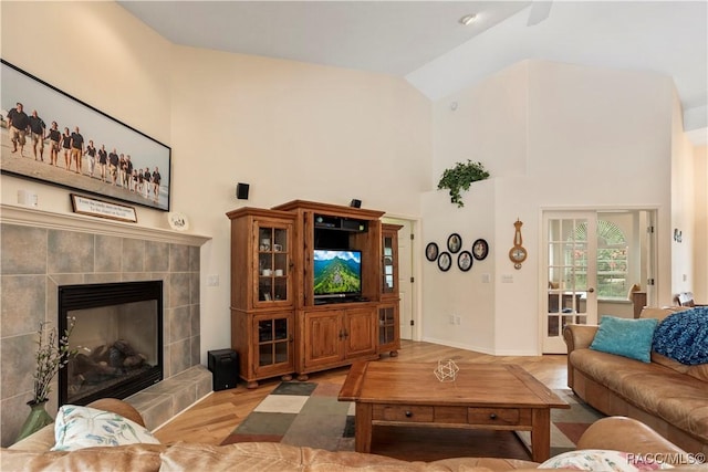 5799 N Oakmont Dr, Beverly Hills, FL 34465 - living room with high vaulted ceiling, wood finished floors, and a fireplace
