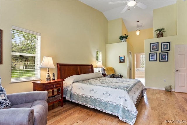 5799 N Oakmont Dr, Beverly Hills, FL 34465 - bedroom with high vaulted ceiling, light wood-type flooring, multiple windows, ensuite bathroom, and a ceiling fan