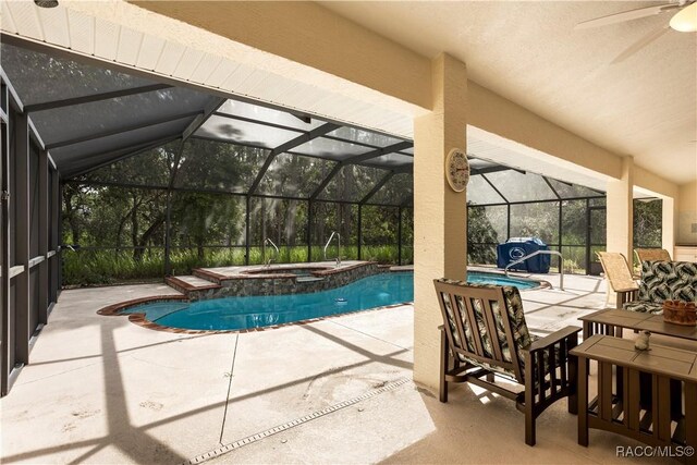 5799 N Oakmont Dr, Beverly Hills, FL 34465 - view of swimming pool featuring ceiling fan, a patio area, glass enclosure, and a pool with connected hot tub