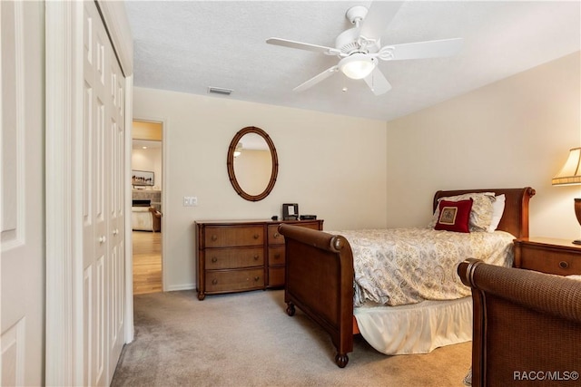 5799 N Oakmont Dr, Beverly Hills, FL 34465 - bedroom with light colored carpet, a closet, and ceiling fan