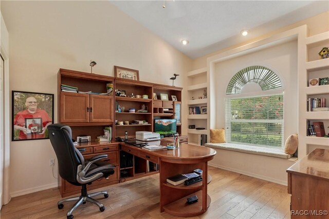 5799 N Oakmont Dr, Beverly Hills, FL 34465 - office featuring built in shelves, light wood-type flooring, and high vaulted ceiling