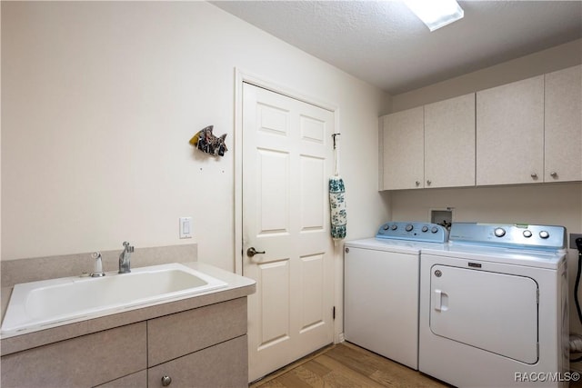 5799 N Oakmont Dr, Beverly Hills, FL 34465 - laundry room with cabinet space, separate washer and dryer, and light wood-style flooring