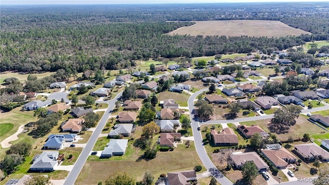 bird's eye view featuring a residential view and a forest view