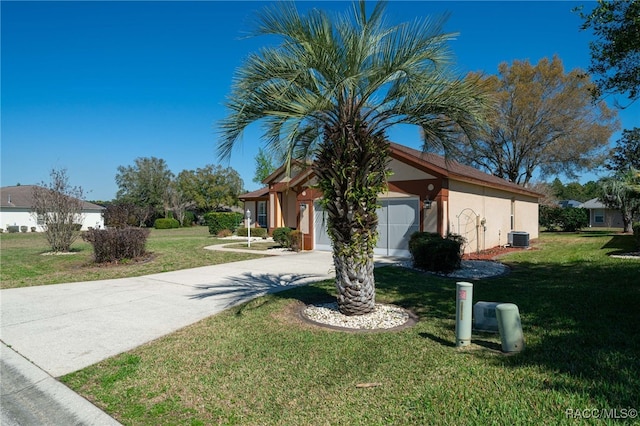 view of front of property featuring stucco siding, central AC, a garage, driveway, and a front lawn