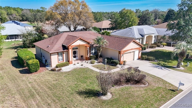 ranch-style house featuring driveway, a front lawn, an attached garage, and stucco siding