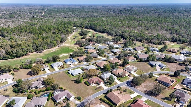 drone / aerial view featuring a forest view